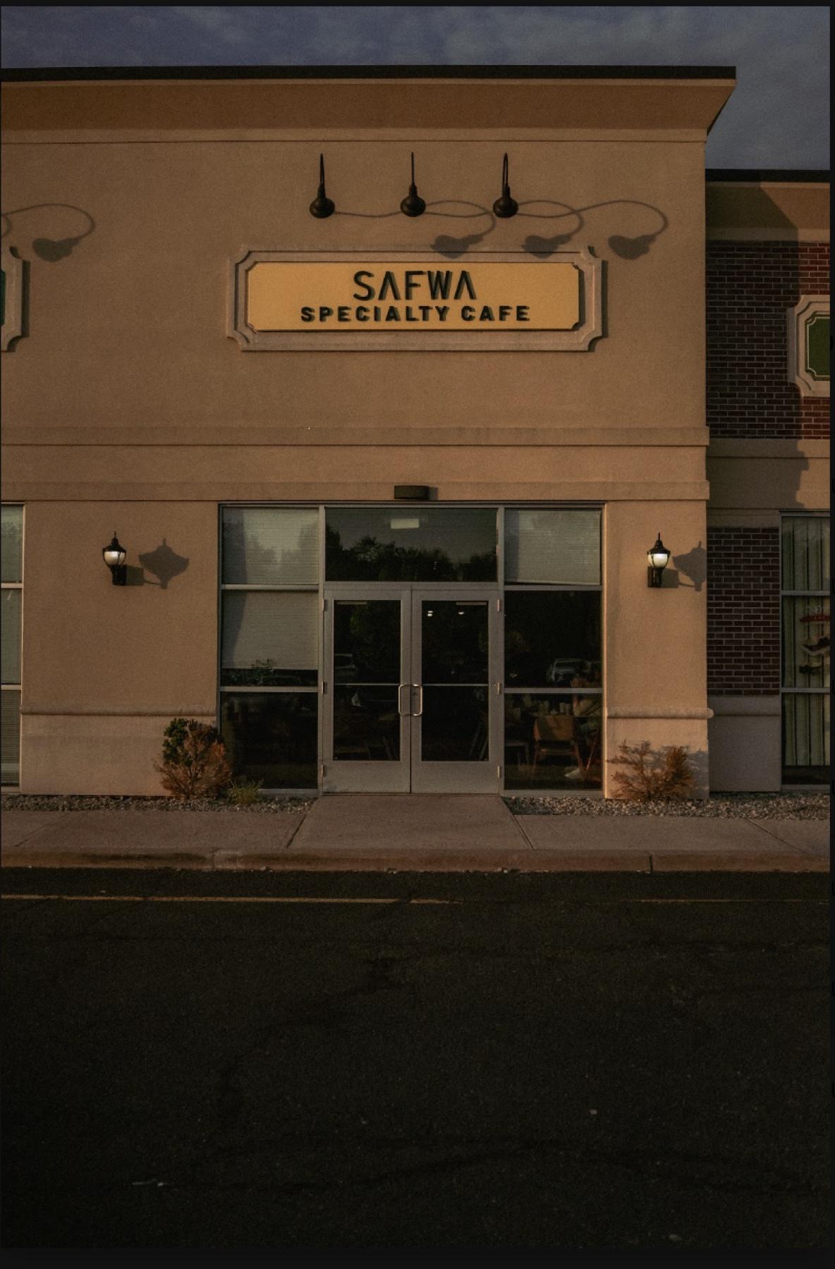 Safwa Specialty Cafe sign glowing at dusk in Somerset, New Jersey